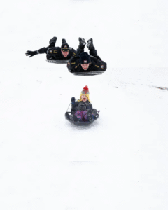 Catch Me If You Can! CUPD Seen Sledding Down Slope in Pursuit of Evil Students Vandalizing Libe Slope with Evil Sleds